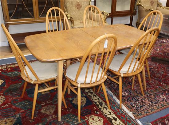 An Ercol dining table and chairs, and a sideboard 150cm, 155cm